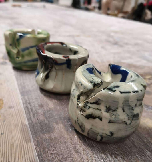 three small ceramic pots